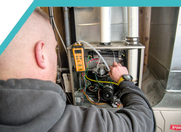 HVAC technician from Wamboldt HVAC repairing a furnace in Ottawa
