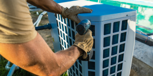 HVAC technician installing a pool heater in Canada