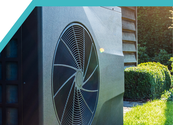 Grey Heat Pump Outside Grey heat pump outside with grass behind it